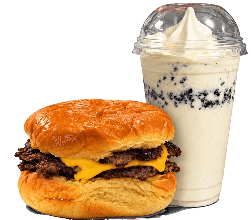 A double cheeseburger with two smashed patties and melted American cheese on a glossy bun, beside a cookies-and-cream-style shake in a domed cup.